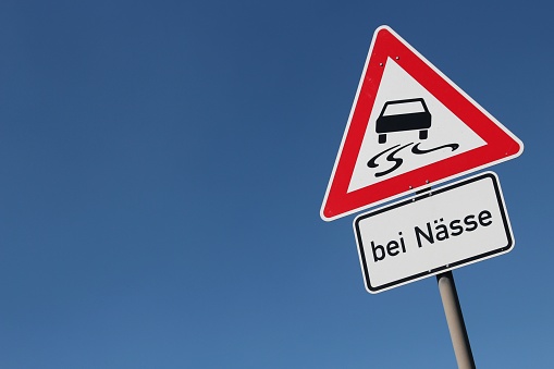 German road sign: slippery when wet
