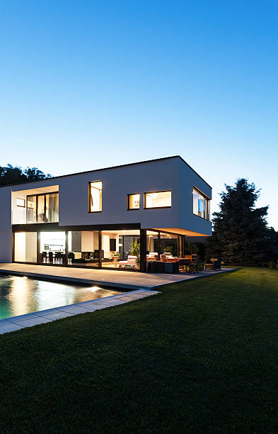 istock Modern villa with an in ground pool at night 175649896