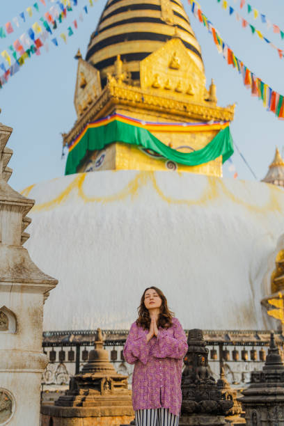 istock Woman doing tree pose on the background of stupa 1756507255