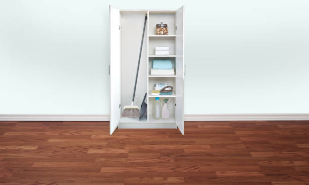 Cabinet with cleaning supplies in an empty laundry room