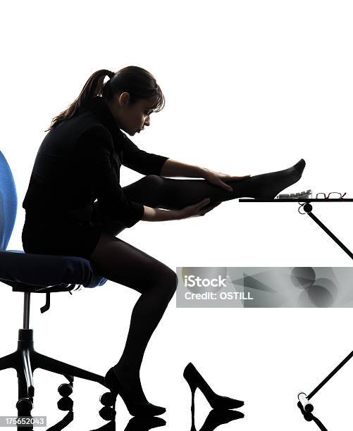 Business Woman Massaging Her Leg Silhouette Stock Photo - Download Image Now - Adult, Adults Only, Business