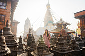 Woman exploring  monkey temple  in Kathmandu