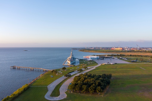 Aerial view of the USS Alabama Battleship Park at sunrise in October 2023