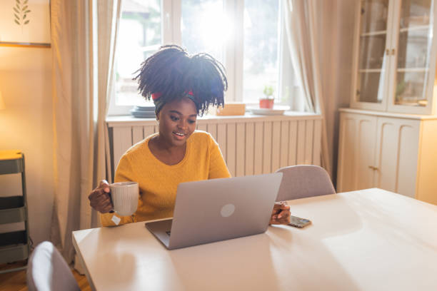istock Young Afro-american woman working on her laptop 1756551090