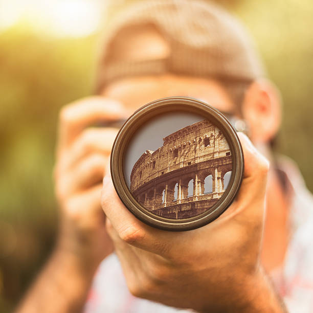 istock Photographer taking a picture in rome at colisuem 175656992