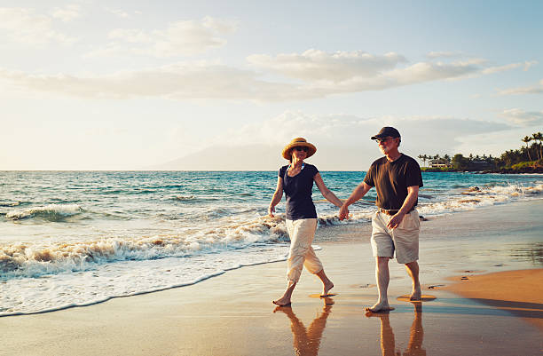 istock Senior Couple Enjoying Sunset at the Beach 175657696