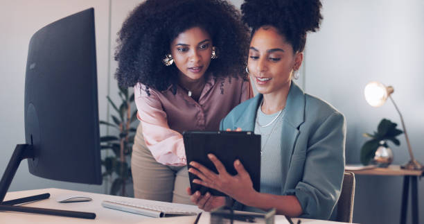 istock Computer, business and women with a tablet, help and discussion with conversation, planning and digital apps. People, manager and employee with technology, coaching and mentor with corporate training 1756585772