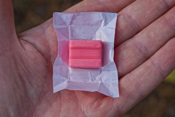 2 pink rectangular pieces of chewing gum from above