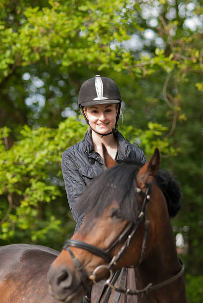 istock Girl sits on her pony 175659375