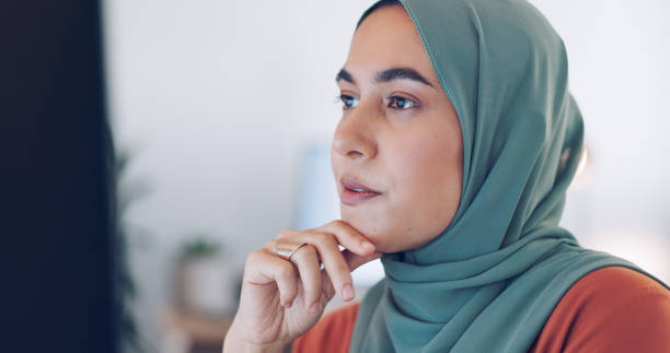istock Business, thinking and Islamic woman with solution, computer or research with email notification, decision or proposal. Muslim person, worker or employee with a pc, review or choice with development 1756597218