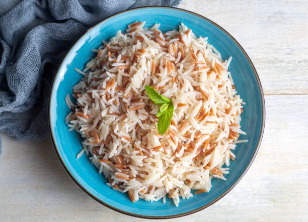 Traditional delicious Turkish food; Turkish style rice pilaf (Turkish name; Arpa sehriyeli pirinc pilavi) Traditional delicious Turkish food; Turkish style rice pilaf (Turkish name; Arpa sehriyeli pirinc pilavi) ARPA stock pictures, royalty-free photos & images