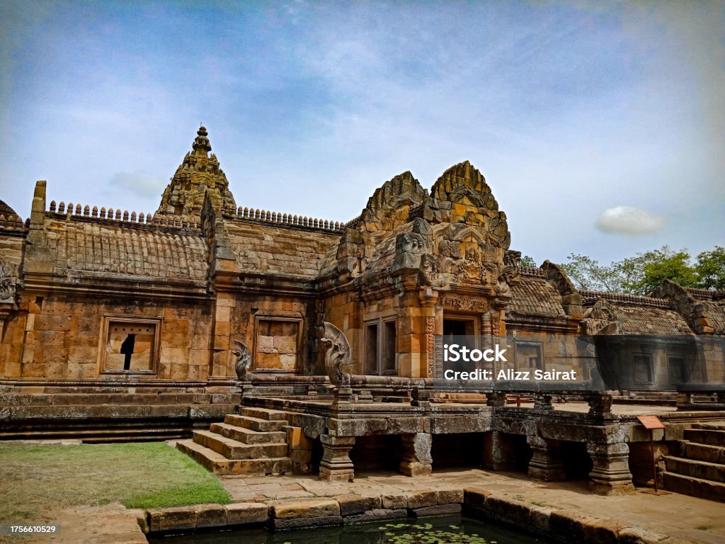 The photo captures the ethereal beauty of Prasat Khao Phanom Rung against the backdrop of the Thai landscape evoking a sense of wonder at the architectural and cultural legacy of the past. Ancient Stock Photo
