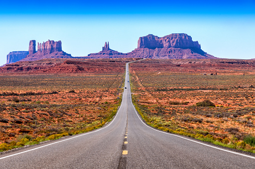 The unique and beautiful landscape of Monument Valley along the borders of Utah and Arizona in America's southwest desert shot from the famed Highway 163.