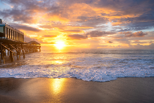 The Cocoa Beach Pier during sunrise at Cocoa Beach in Central Florida USA