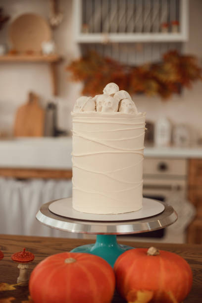 istock Halloween cake idea. Cake with spider webs and skulls. The kitchen is decorated for autumn 1756641745