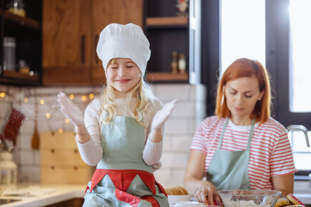 istock Playful cute little girl in the kitchen 1756660745