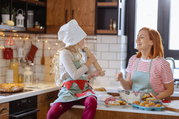 istock Mother and daughter having fun in the kitchen 1756663460
