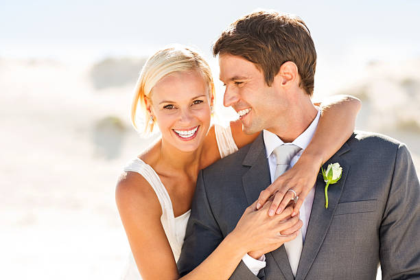 istock Happy Bride Embracing Groom On Beach 175666840