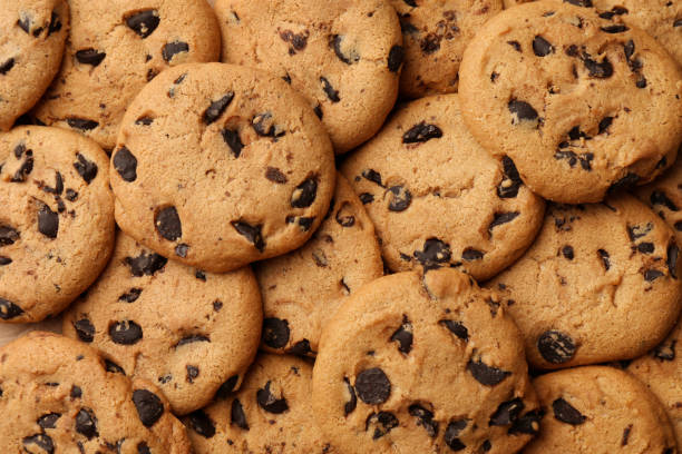 istock Delicious chocolate chip cookies as background, top view 1756680803