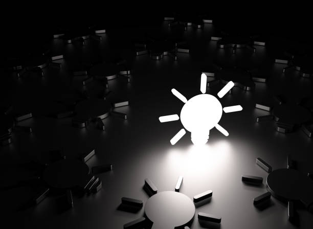 istock White Light Bulb Symbol Glowing Amid Black Lightbulb Symbols On Black Background 1756681330