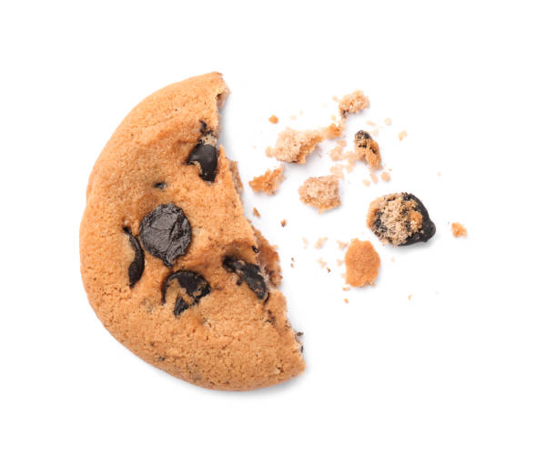istock Piece of delicious chocolate chip cookie isolated on white, top view 1756682479