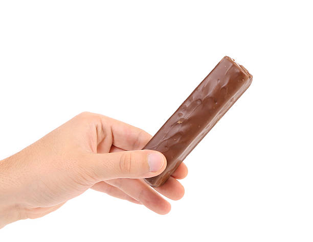 istock Hand holds bar of chocolate. 175668695