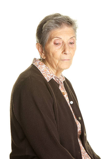 istock Sad or Lonely Elderly Woman on White Background Looking Down 175669228