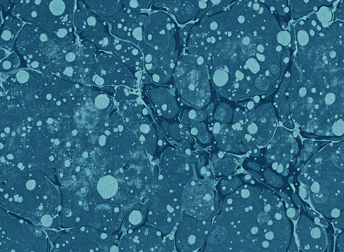 Antique blue paper marbling background texture.