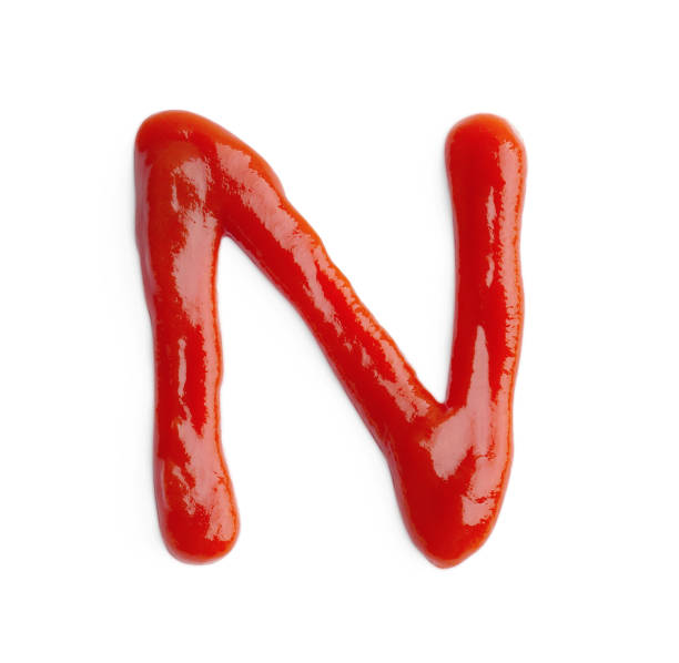 istock Letter N written with ketchup on white background 1756710149