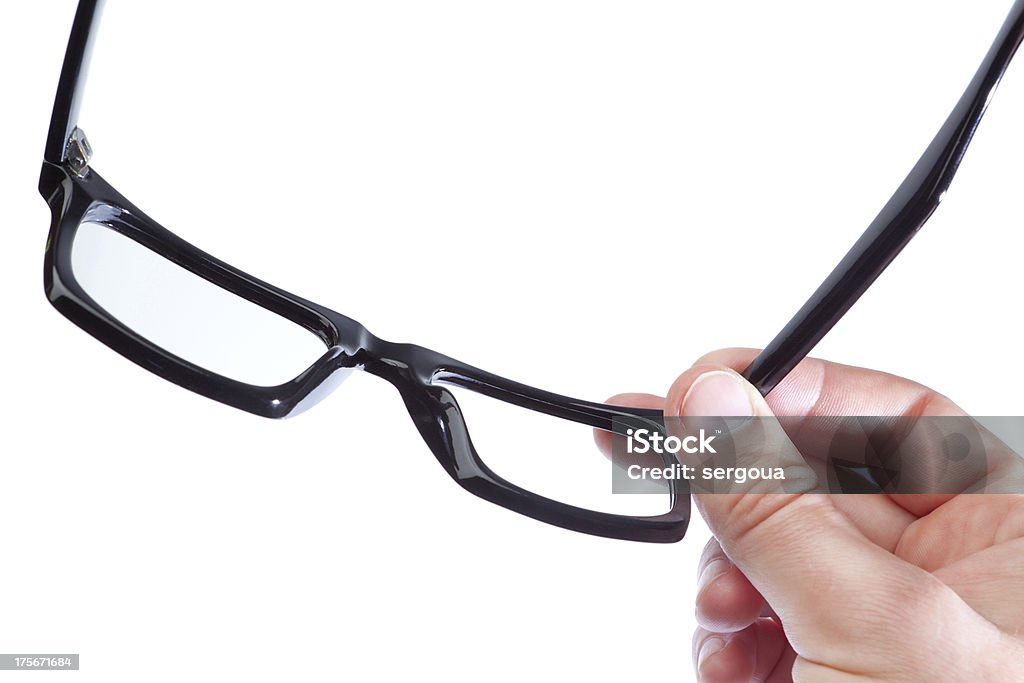 Gli occhiali nelle mani di un uomo su sfondo bianco. - Foto stock royalty-free di Accessorio personale