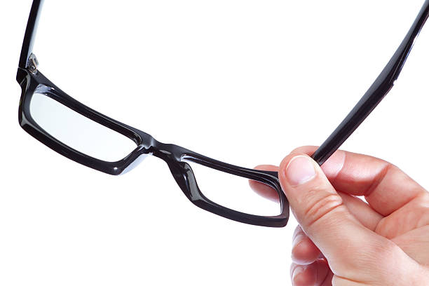 istock Glasses in the hand of a man on white background. 175671684