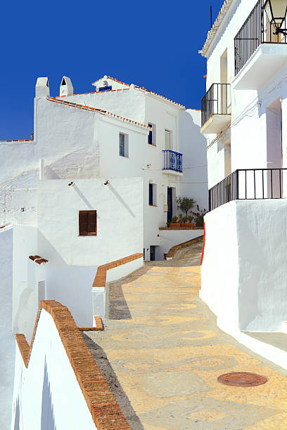 istock Pathway leading through the village Frigiliana 175673956