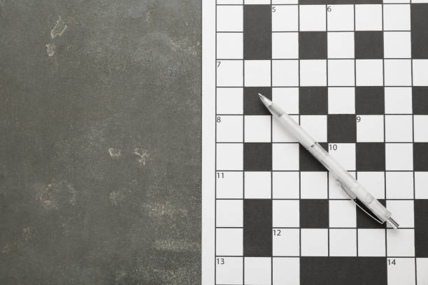 istock Blank crossword and pencil on grey table, top view. Space for text 1756768077
