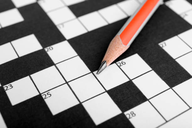 istock Pencil on blank crossword, closeup view. Intellectual entertainment 1756769502