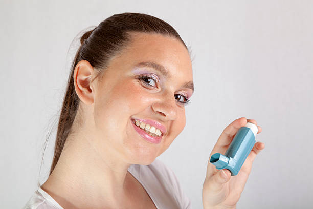 istock Cute girl with asthma inhaler 175677678