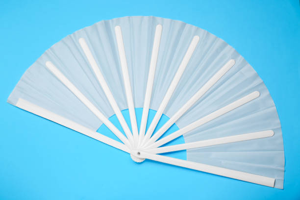istock Stylish white hand fan on light blue background, top view 1756778788