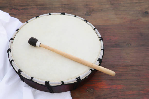 istock Modern drum with drumstick on wooden table. Space for text 1756779350