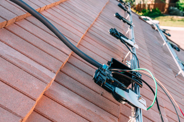 istock Solar PV Combiner Box and Microinverters mounted on a Rail for Solar Panels 1756783568