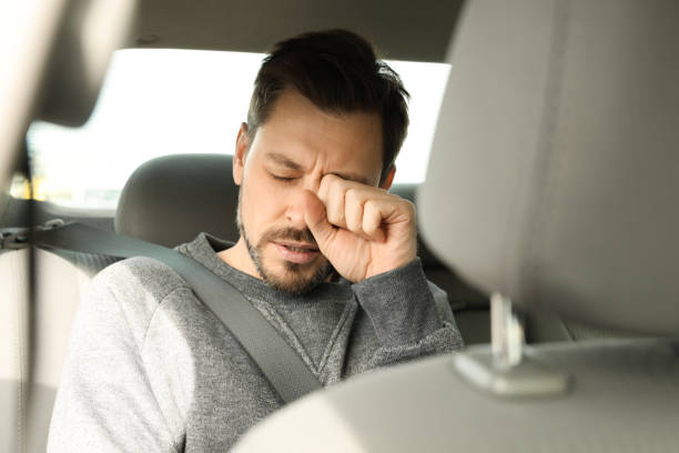 istock Sleepy tired man sitting in modern car 1756814172