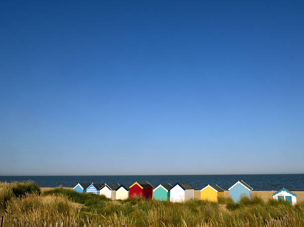 English Beach huts Beach huts amongst the coastal dunes southwold stock pictures, royalty-free photos & images