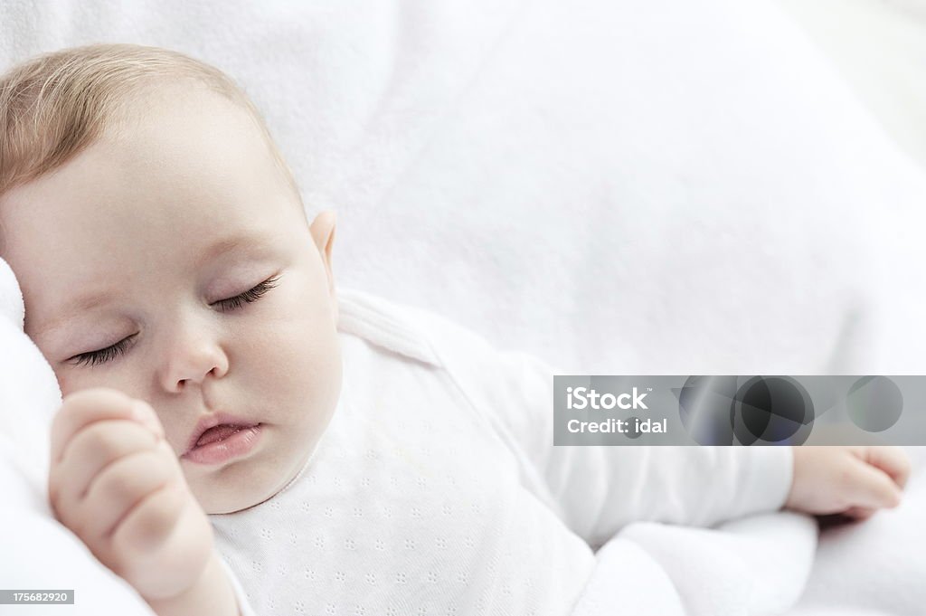 Sleeping baby Carefree sleeping little baby on a bed Baby - Human Age Stock Photo