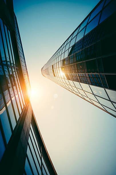 istock Modern office building with reflecting sun at dawn 175683503