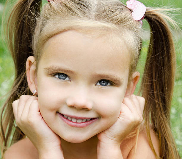istock Cute smiling little girl on the meadow 175683639