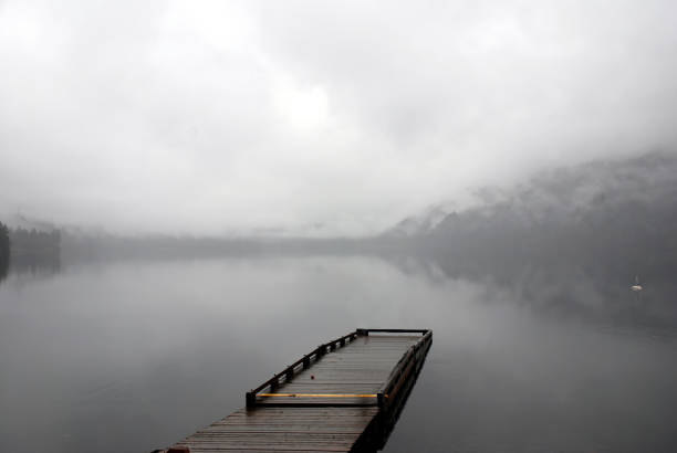 istock Empty wharf on lake in very heavy fog 1756839138