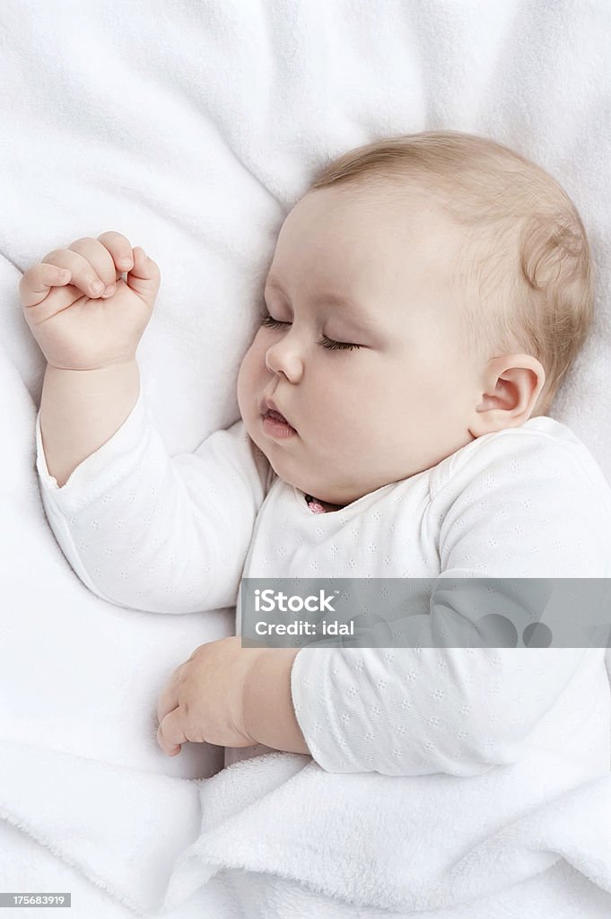 Sleeping baby Carefree sleeping little baby on a bed Baby - Human Age Stock Photo
