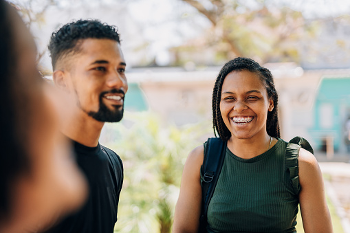 Young college students smiling on campus