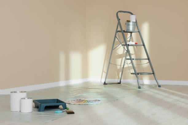 istock Stepladder and painting tools near wall in empty room, space for text 1756844138
