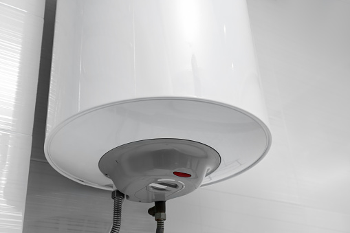 White boiler with maximum energy efficiency indicator indoors