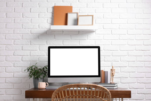 istock Cozy workspace with modern computer on wooden desk 1756844692