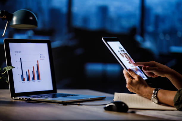 istock Woman sitting at her desk at the office, using digital tablet 1756914144
